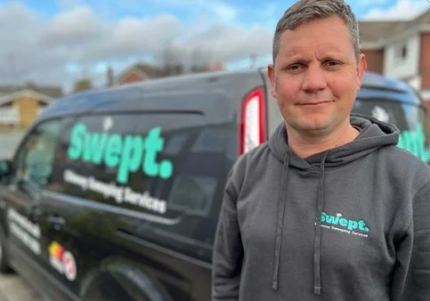 Gary Walker Swept. van A man stands next to a van branded for Swept. Chimney Sweeping Services in Huddersfield.